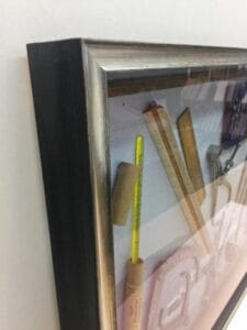 Close up of Shadow box frame with Mariners tools