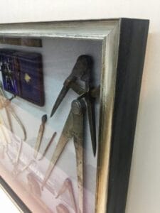 Shadow box frame with Mariners tools' close up